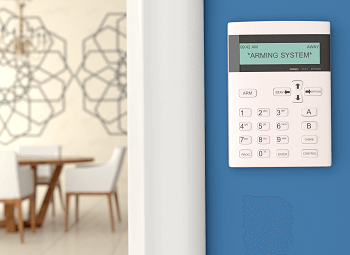control panel for a security system on an interior wall of a home