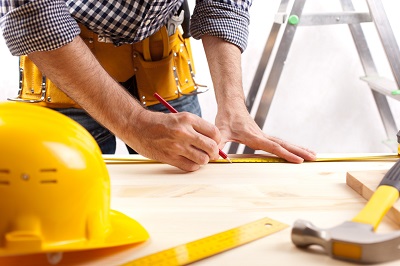 Man looking over construction plans